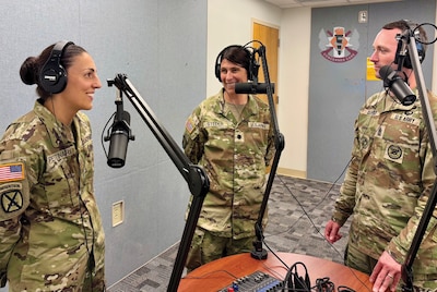 FORT RUCKER, Ala.-- Lyster Army Health Clinic leadership discusses mental fitness and force readiness during a recording session for the Lyster Health Talks podcast at Fort Rucker, Alabama on July 3, 2026. From left: Maj. Daniella Pettinari, Deputy Commander for Clinical Services; Lt. Col. Leah Steder, Commander of Lyster Army Health Clinic; and Sgt. Maj. Garret Cleland, Senior Enlisted Advisor. The clinic compiled the eight-part Aviation Medicine miniseries to help aircrews proactively manage their medical flight status.