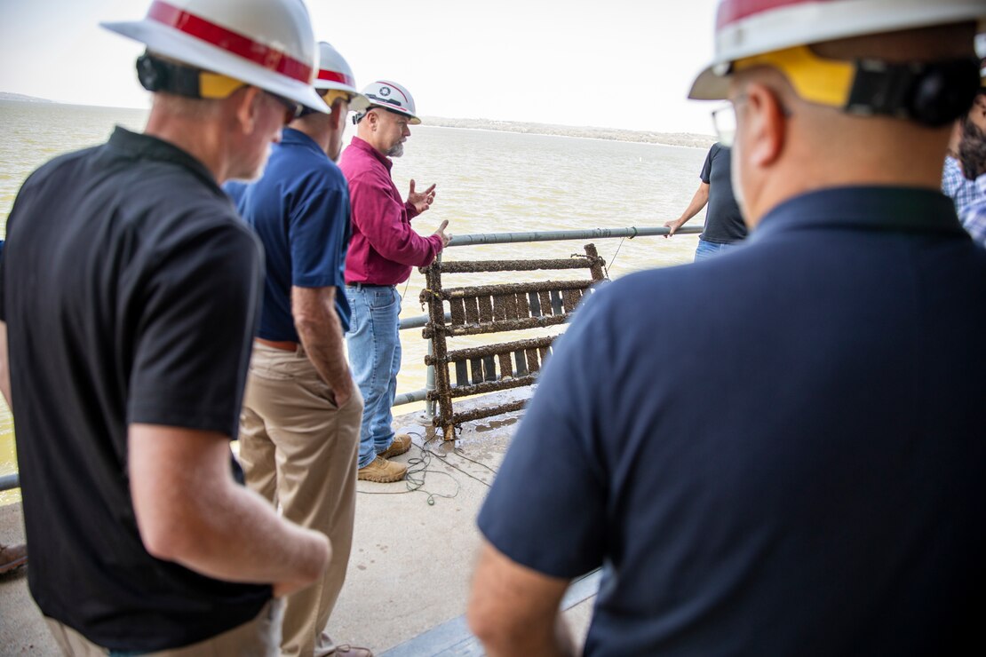 Eric Johnson, Gavins Point Dam assistant power plant superintendent and maintenance and operations manager, U.S. Army Corps of Engineers, Omaha District, shares information about invasive zebra mussels to a team of Walla Walla District operations during their visit to Gavins Point in Yankton, South Dakota, Aug. 26, 2026.