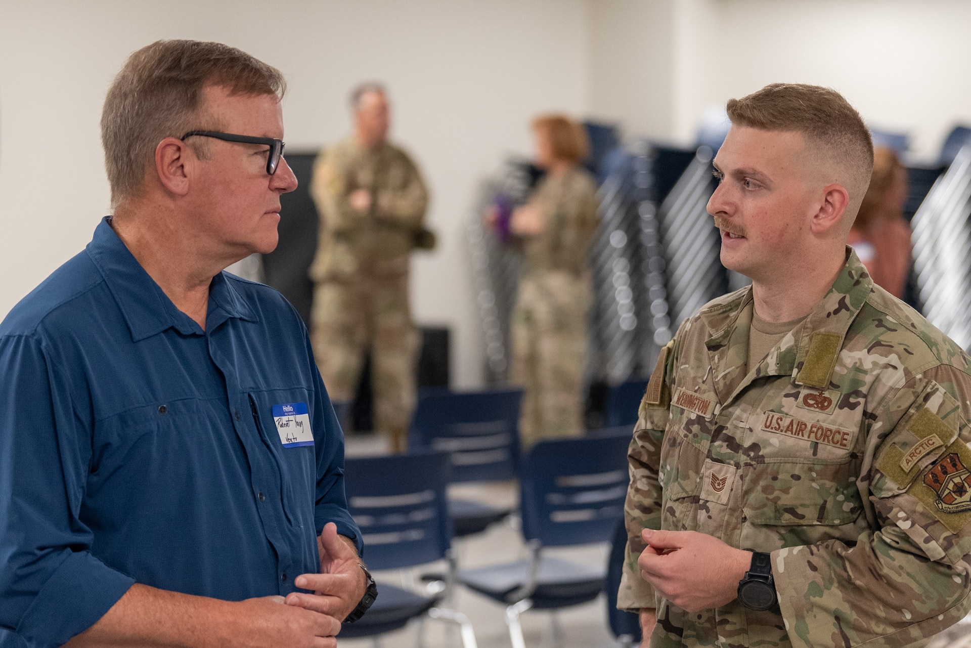U.S. Air Force Tech. Sgt. Ryan Weddington, right, an aerospace ground equipment technician with the Kentucky Air National Guard’s 123rd Contingency Response Support Squadron, talks to Robert Young, his civilian boss at Vertx, a uniform-manufacturing company, during an Employer Support the Guard and Reserve event at the Kentucky Air National Guard Base in Louisville, Ky., Sept. 10, 2026. The event, called a “Bosslift,” gave civilian employers an opportunity to tour the base, fly on a Kentucky Air Guard C-130J Super Hercules aircraft and visit the National Museum of the United States Air Force in Dayton, Ohio, providing them with a better understanding of the Air National Guard mission and the role their employees play in it as part-time Airmen in the Kentucky Guard and reservists of the United States Air Force. (U.S. Air National Guard photo by Phil Speck)
