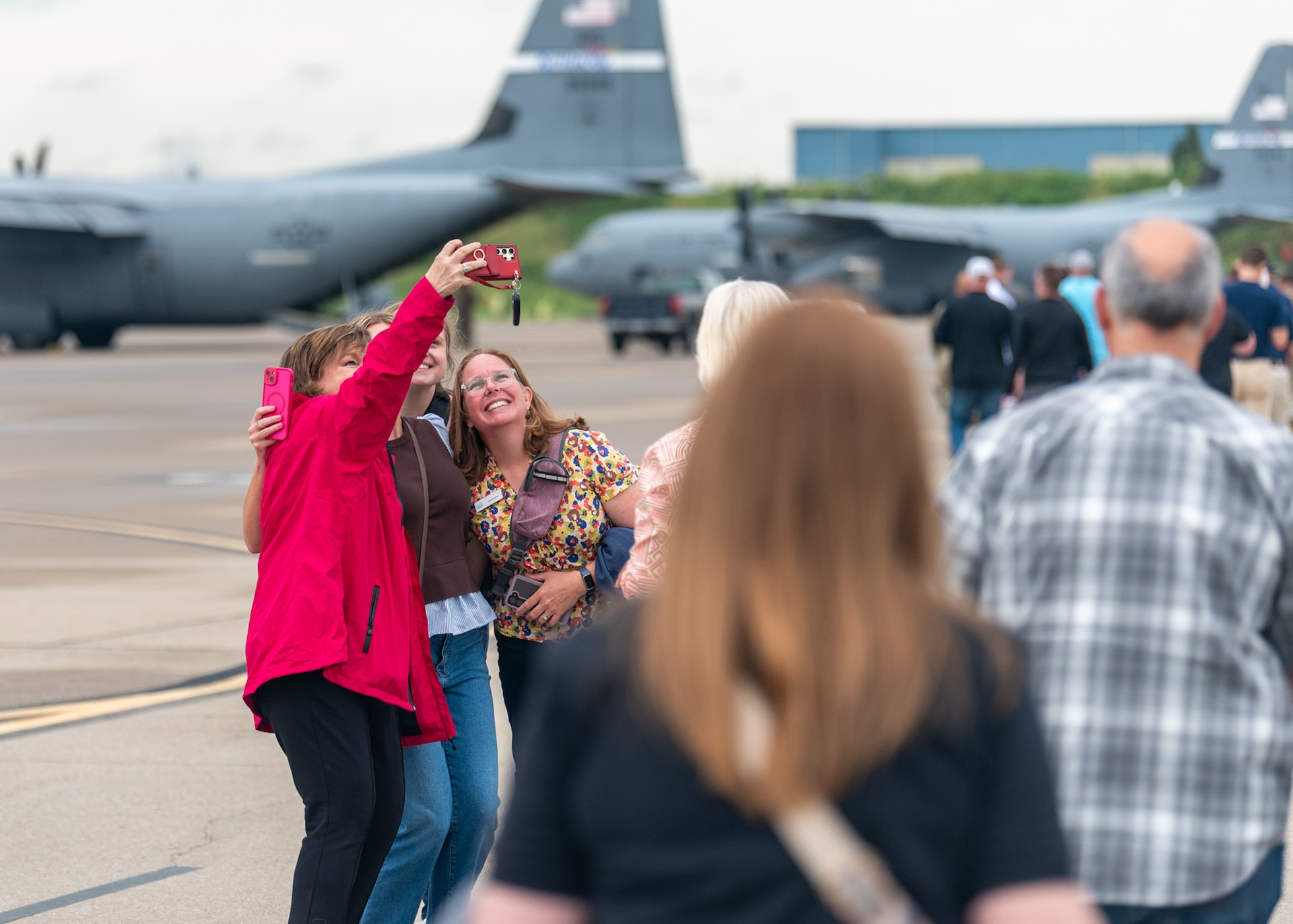 A group of civilian employers takes a selfie before boarding a 123rd Airlift Wing C-130J Super Hercules during an Employer Support of the Guard and Reserve Bosslift at the Kentucky Air National Guard Base in Louisville, Ky., Sept. 10, 2026. The event gave employers an opportunity to tour the base and fly to the National Museum of the United States Air Force in Dayton, Ohio, providing them with a better understanding of the Air National Guard mission and the role their employees play in it as part-time Airmen in the Kentucky Guard and reservists of the United States Air Force. (U.S. Air National Guard photo by Phil Speck)