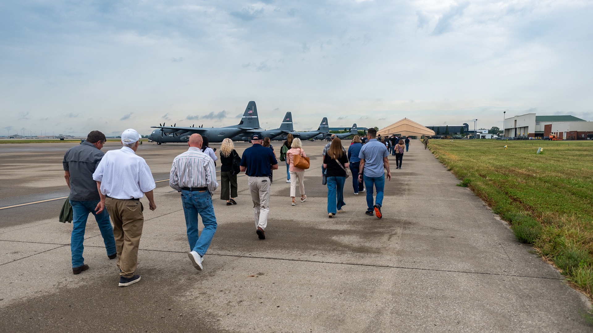 A group of civilian employers walk to a 123rd Airlift Wing C-130J Super Hercules during an Employer Support of the Guard and Reserve Bosslift at the Kentucky Air National Guard Base in Louisville, Ky., Sept. 10, 2026. The event gave employers an opportunity to tour the base and fly to the National Museum of the United States Air Force in Dayton, Ohio, providing them with a better understanding of the Air National Guard mission and the role their employees play in it as part-time Airmen in the Kentucky Guard and reservists of the United States Air Force. (U.S. Air National Guard photo by Phil Speck)
