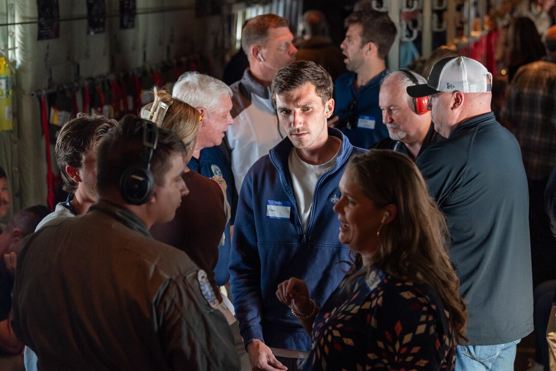 U.S. Air Force Tech. Sgt. Nate Dunlap, left, a loadmaster with the 165th Airlift Squadron, talks to a group of civilian employers aboard a 123rd Airlift Wing C-130J Super Hercules aircraft during an Employer Support of the Guard and Reserve Bosslift at the Kentucky Air National Guard Base in Louisville, Ky., Sept. 10, 2026. The event gave employers an opportunity to tour the base and fly to the National Museum of the United States Air Force in Dayton, Ohio, providing them with a better understanding of the Air National Guard mission and the role their employees play in it as part-time Airmen in the Kentucky Guard and reservists of the United States Air Force. (U.S. Air National Guard photo by Phil Speck)