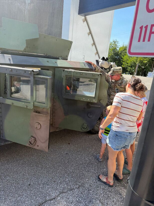 Festival attendees get a firsthand look at a Humvee during Riverfest 2026 as Kentucky National Guard Soldiers with the 617th Military Police Company, 198th Military Police Battalion display their vehicle in Newport, Kentucky, Sept. 6, 2026.
