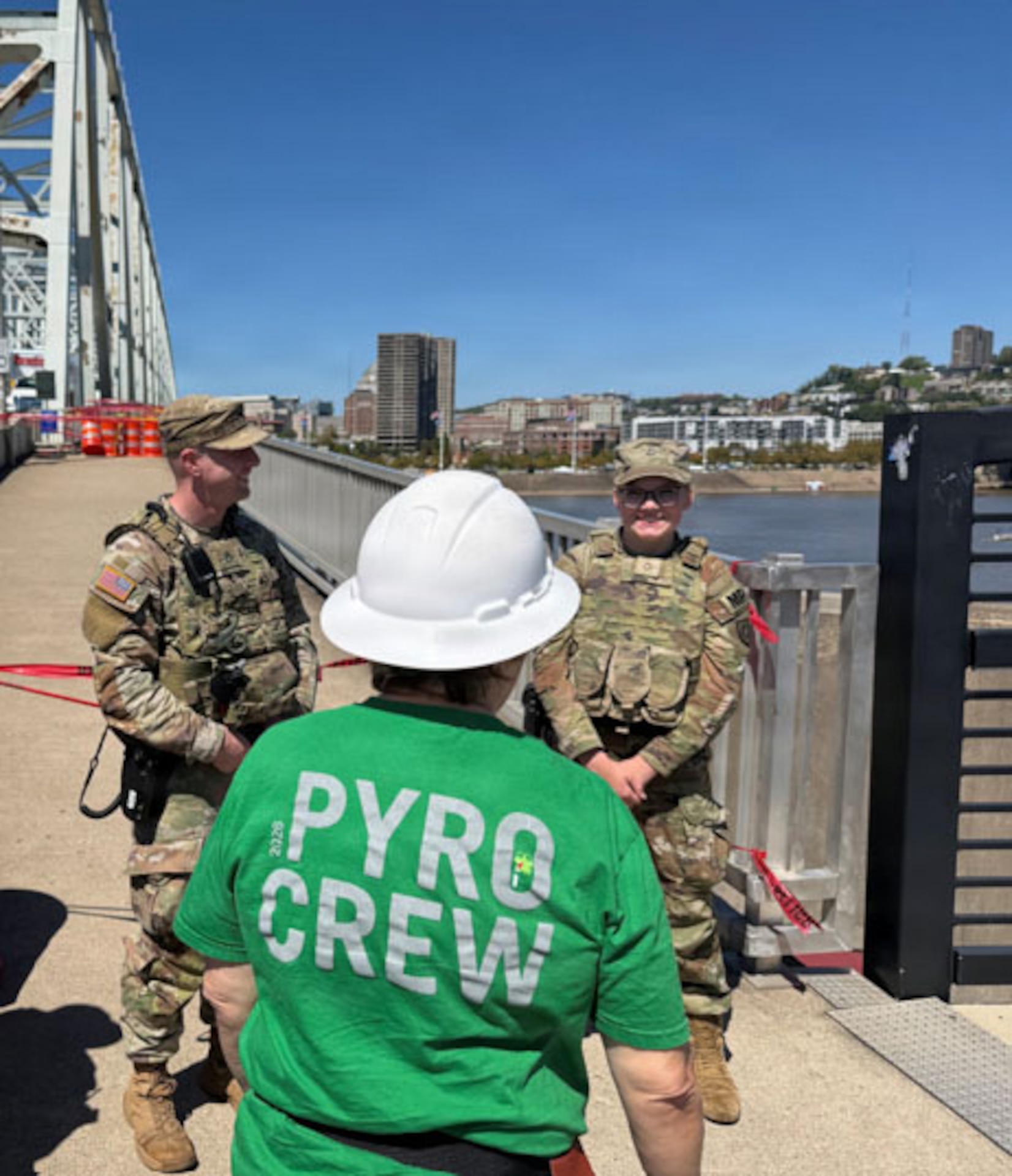 Kentucky National Guard Soldiers with the 617th Military Police Company, 198th Military Police Battalion speak with a member of the pyrotechnics team during their recent mission working with the Newport Police Department for Riverfest 2026 in Newport, Kentucky, Sept. 6, 2026.