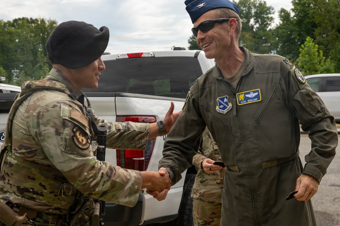 Service member receives and award in uniform.