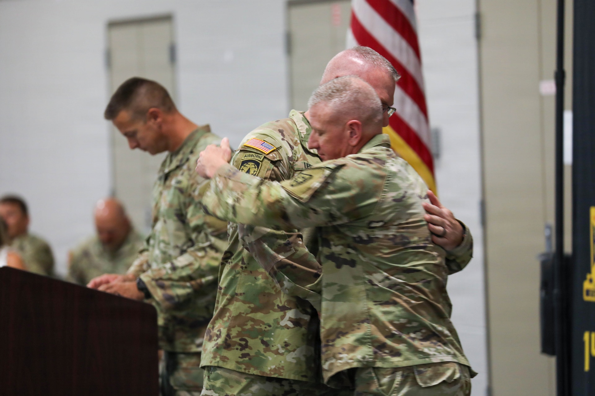 U.S. Army Command Sgt. Maj. Aaron T. Lester, outgoing command sergeant major of Kentucky's 149th Maneuver Enhancement Brigade, embraces incoming Command Sgt. Maj. Bryan M. Jefferson during their change of responsibility ceremony at the National Guard Armory in Richmond, Kentucky, Sept. 11, 2026.