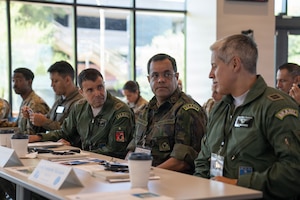 Brazilian air force members discuss applications of space operations during the 2026 Space Doctrine Conference in Tucson, Arizona, Sept. 1, 2026. The conference brought together U.S. and partner-nation representatives to advance space doctrine, develop regional Centers of Excellence and identify opportunities for future multinational cooperation
