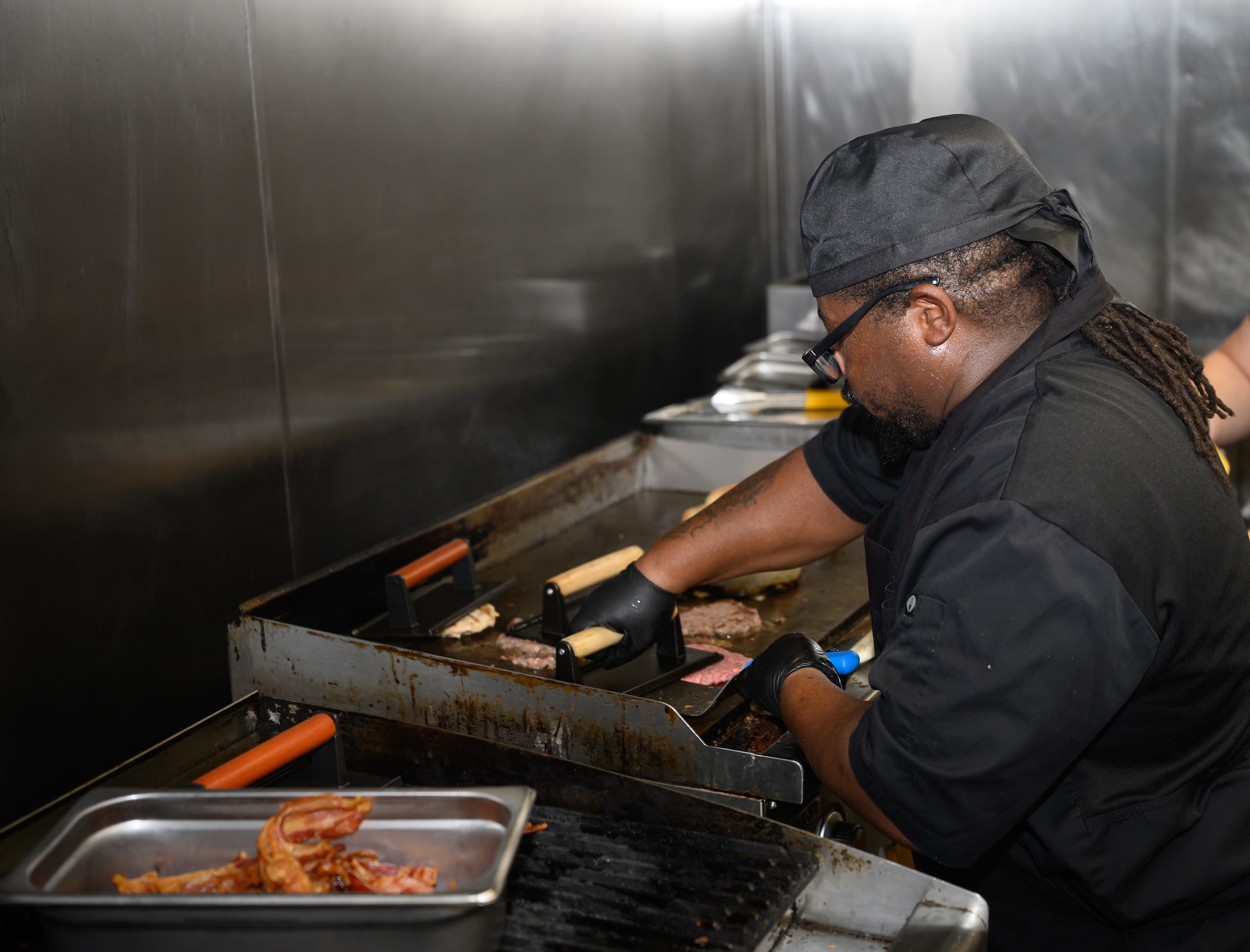 person works in kitchen