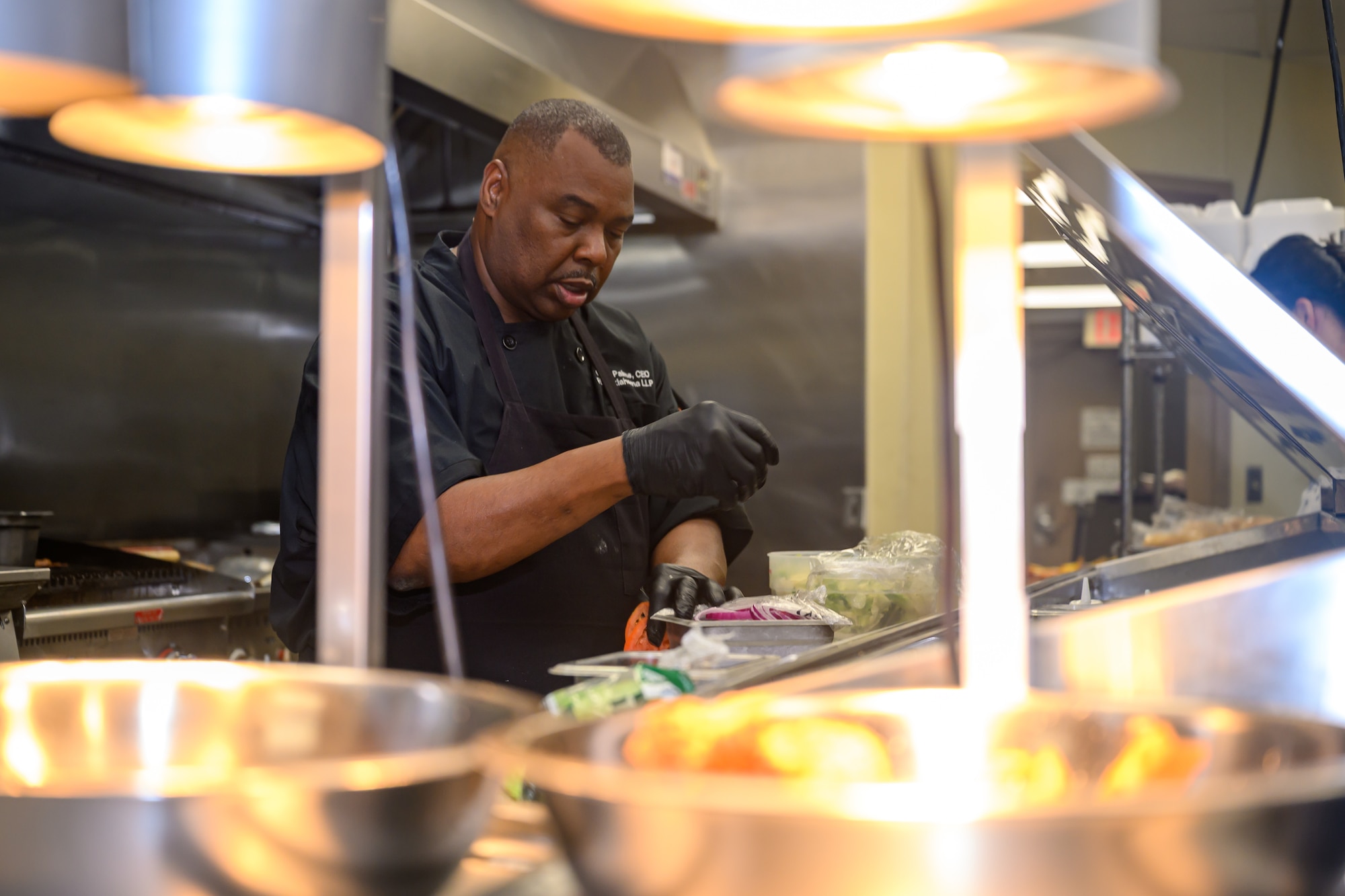 person works in kitchen