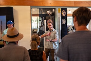 a person speaks to a group of people
