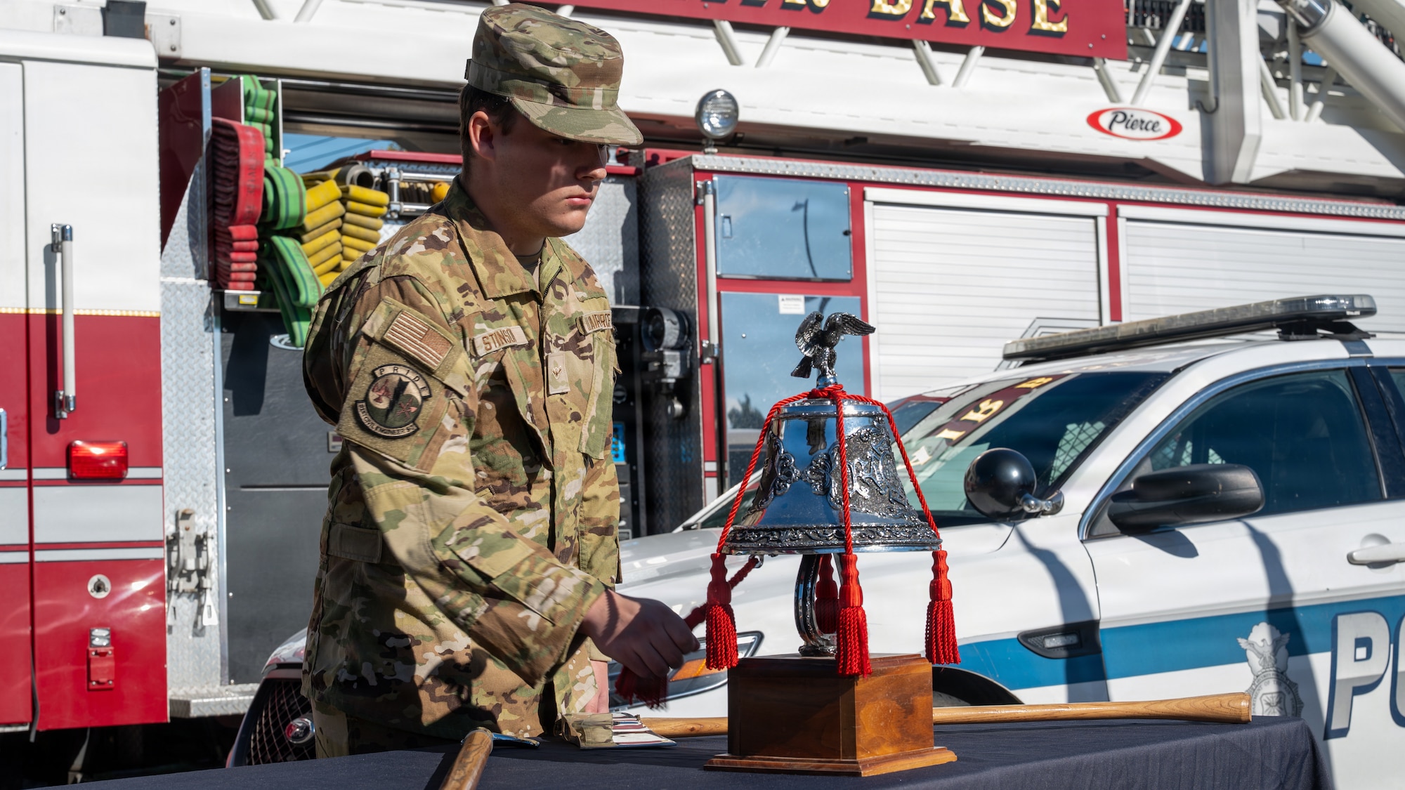 U.S. Airman Elijah Stinson, 51st Civil Engineer Squadron firefighter, rings a ceremonial bell during a 9/11 Memorial Ceremony at Osan Air Base, Republic of Korea, Sept. 11, 2026. The bell ceremony honored firefighters who have made the ultimate sacrifice in the line of duty, paying tribute to the first responders who gave their lives while responding to the Sept. 11, 2001, terrorist attacks. (U.S. Air Force photo by Senior Airman Megan Cusmano)