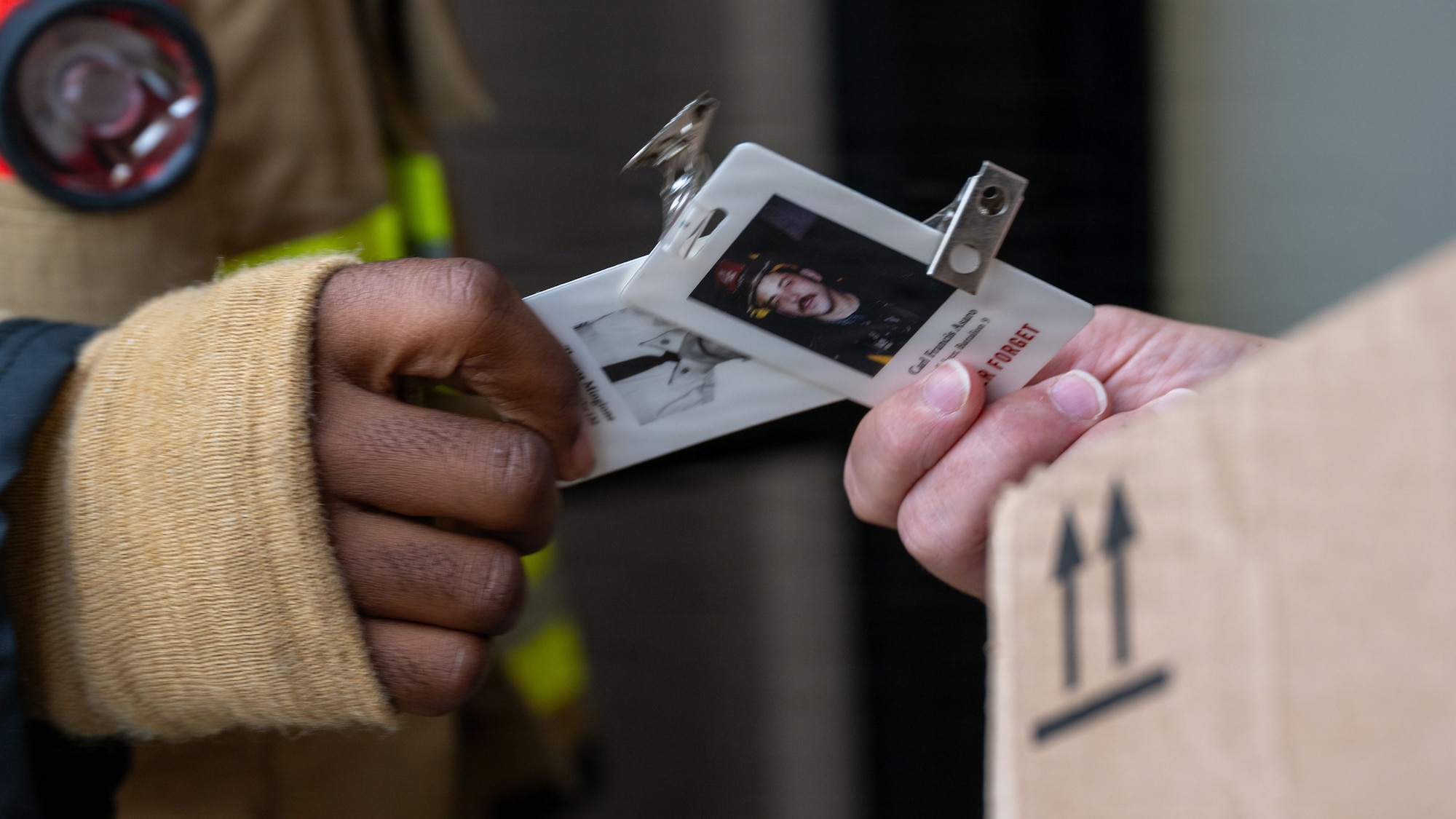A participant is given a commemorative badge during a 9/11 memorial stair climb at Osan Air Base, Republic of Korea, Sept. 11, 2026. Each step served as an act of remembrance for the victims and first responders whose lives were lost during and following the attacks. (U.S. Air Force photo by Senior Airman Rome Bowermaster)