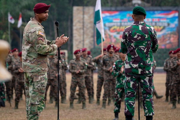 U.S. Army Lt. Col Dwayne Steppe, commander of the 1st Battalion, 501st Parachute Infantry Regiment, 2nd Mobile Brigade Combat Team (Airborne), 11th Airborne Division, applauds multinational forces at the closing ceremony of Super Garuda Shield 26 at Baturaja Combat Training Center, Indonesia, Sept. 11 2026.