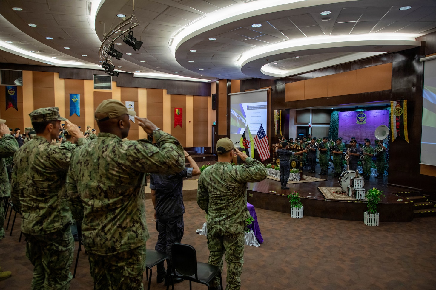 Royal Brunei Armed Forces and U.S. service members render salutes during the playing of the national anthems of Brunei and the United States during the opening ceremony for exercise Cooperation Afloat Readiness and Training (CARAT) Brunei 2026, Sept. 14, 2026. CARAT Brunei 2026 is a bilateral exercise designed to enhance U.S. and partner navies’ abilities to operate together in response to shared maritime security challenges in the Indo-Pacific region. (U.S. Navy photo by Mass Communication Specialist 1st Class Dakota L. David)