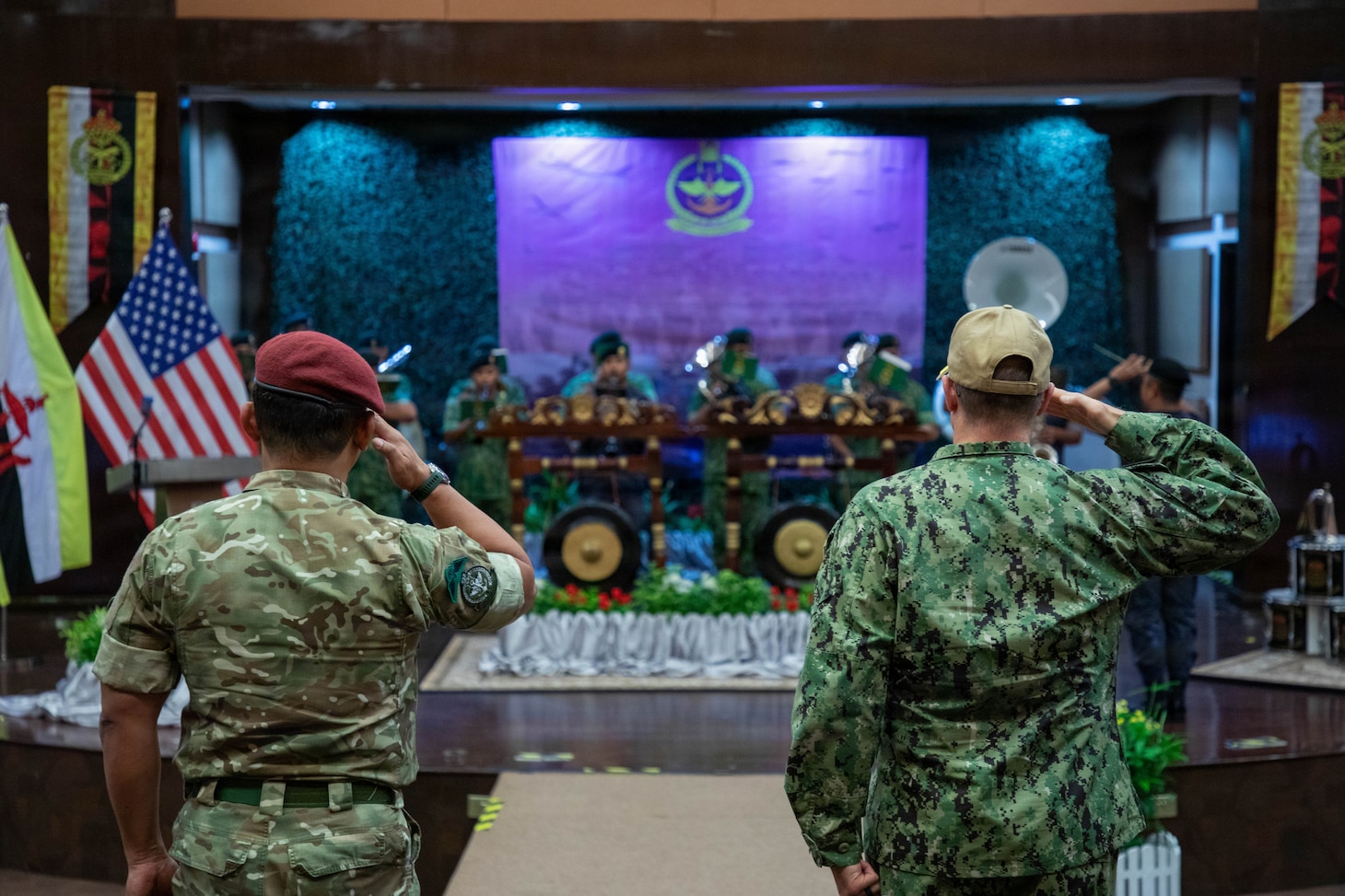 Col. Muhammad Suwardi Ariffin, left, chief of staff of Joint Force Headquarters, Royal Brunei Armed Forces, and U.S. Coast Guard Capt. Michael Ross, right, commodore of Expeditionary Cutter Squadron, render salutes during the playing of the national anthems of Brunei and the United States during the opening ceremony for exercise Cooperation Afloat Readiness and Training (CARAT) Brunei 2026, Sept. 14, 2026. CARAT Brunei 2026 is a bilateral exercise designed to enhance U.S. and partner navies’ abilities to operate together in response to shared maritime security challenges in the Indo-Pacific region. (U.S. Navy photo by Mass Communication Specialist 1st Class Dakota L. David)