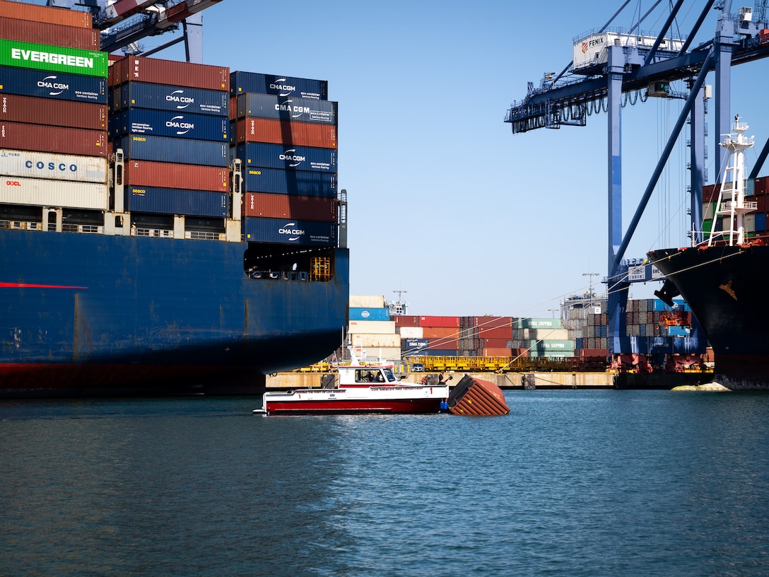 A Los Angeles Fire Department 40-foot small boat crew pushes a container to the pier at the Los Angeles Harbor, Sept. 14, 2026.