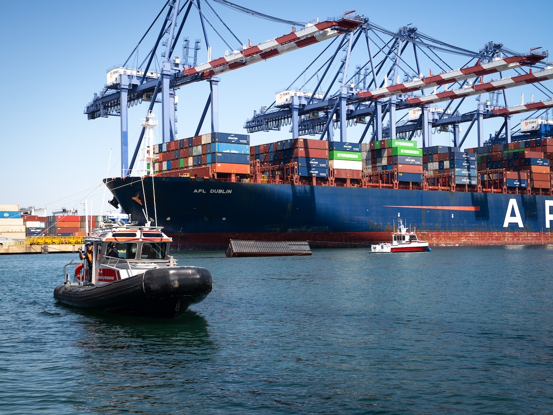 A Los Angeles Fire Department 40-foot small boat crew pushes a container to the pier at the Los Angeles Harbor, Sept. 14, 2026.