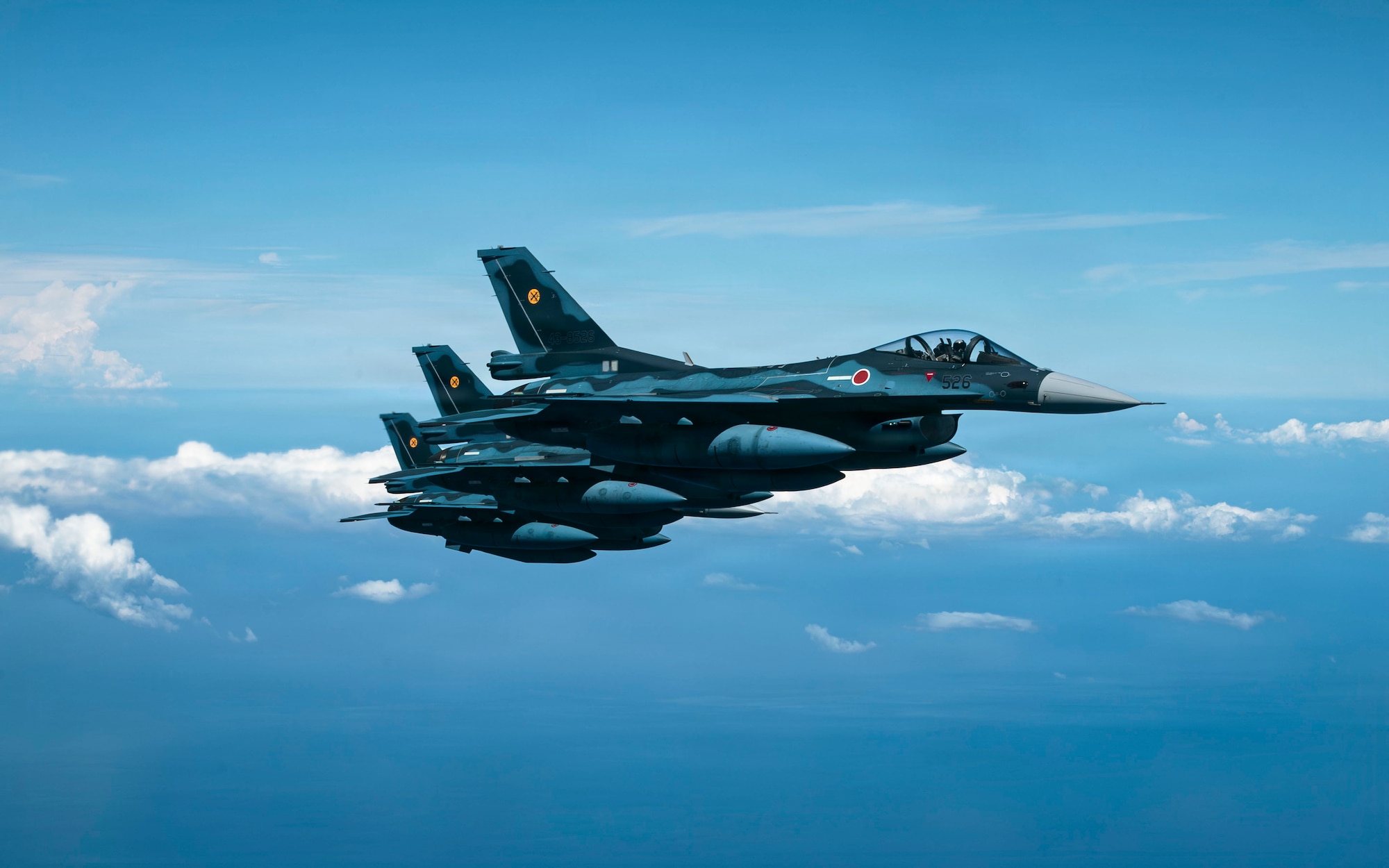 Three Japan Air Self-Defense Force Mitsubishi F-2s assigned to the 8th Air Wing fly alongside a KC-135 Stratotanker assigned to the 909th Air Refueling Squadron during bilateral training over the Pacific Ocean, Sept. 2, 2026.