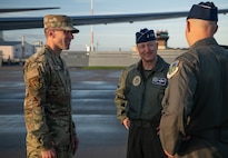 From right, U.S. Air Force Col. Nicholas Jurewicz, 48th Fighter Wing deputy commander, Chairman of the Joint Chiefs of Staff Air Force Gen. Dan Caine, and Chief Master Sgt. Christopher Burrows, 48th Mission Support Group senior enlisted leader, greet one another during a visit at RAF Lakenheath, England, Sept. 14, 2026.