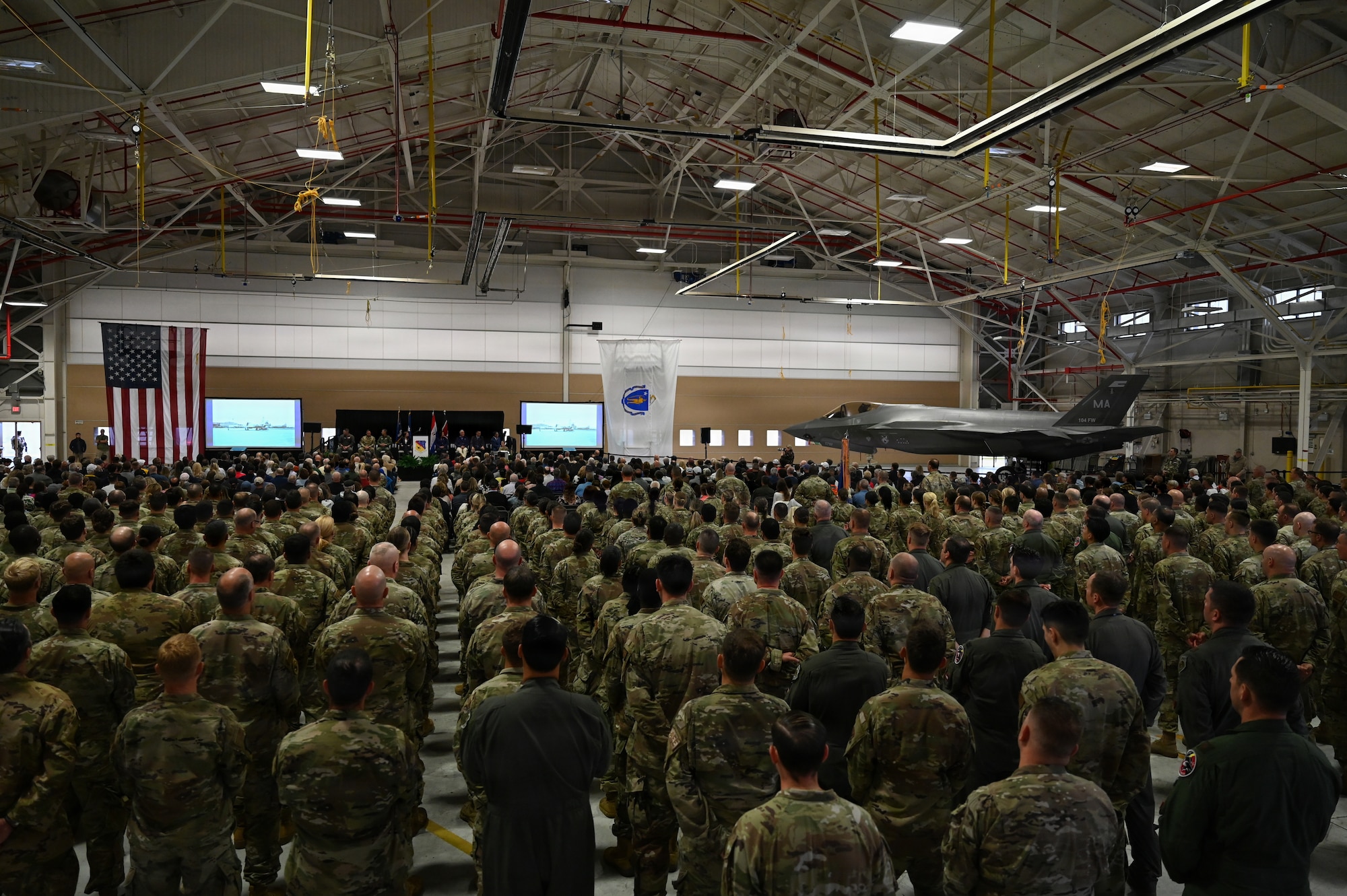Airmen from the 104th Fighter Wing spectate the F-35 arrival ceremony at Barnes Air National Guard Base, Westfield, Mass., Sept. 13 2026. The official arrival of the F-35 to Barnes marks the culmination of a decade of effort, including work by military officials, Massachusetts state lawmakers, congressional committees, and local civic partners. The 104th's new mission to provide lethal and ready airpower to combatant commanders anytime and anywhere carries forth the heritage of the National Guard first formed in Massachusetts over 250 years ago - always ready, and by the sword. (U.S. Air National Guard Photo by Airman 1st Class Ellen Ozkaptan)