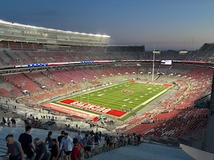 Photo of Buckeyes stadium with people walking up and down stadium steps.