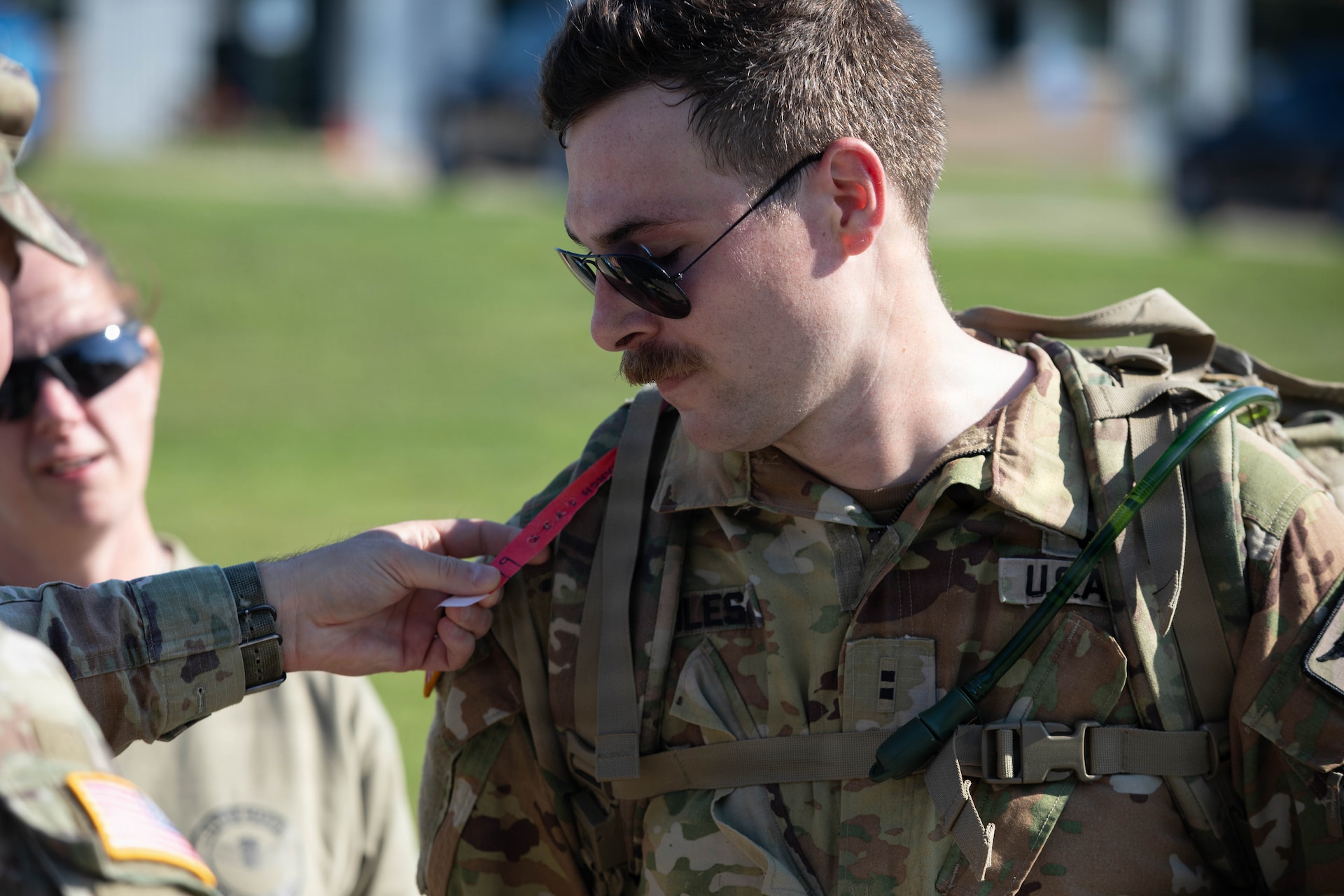 U.S. Army Chief Warrant Officer 2 Andrew Miles being marked as he completes his final lap in the inaugural Danish Flyver Ruck March at Boone National Guard Center in Frankfort, August 28.
