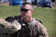 U.S. Army Capt. Jay Brough being marked as he completes his final lap in the inaugural Danish Flyver Ruck March at Boone National Guard Center in Frankfort, August 28. More than 140 Soldiers, Airmen and civilians took part in the event. (U.S. Army National Guard photo by Milt Spalding)