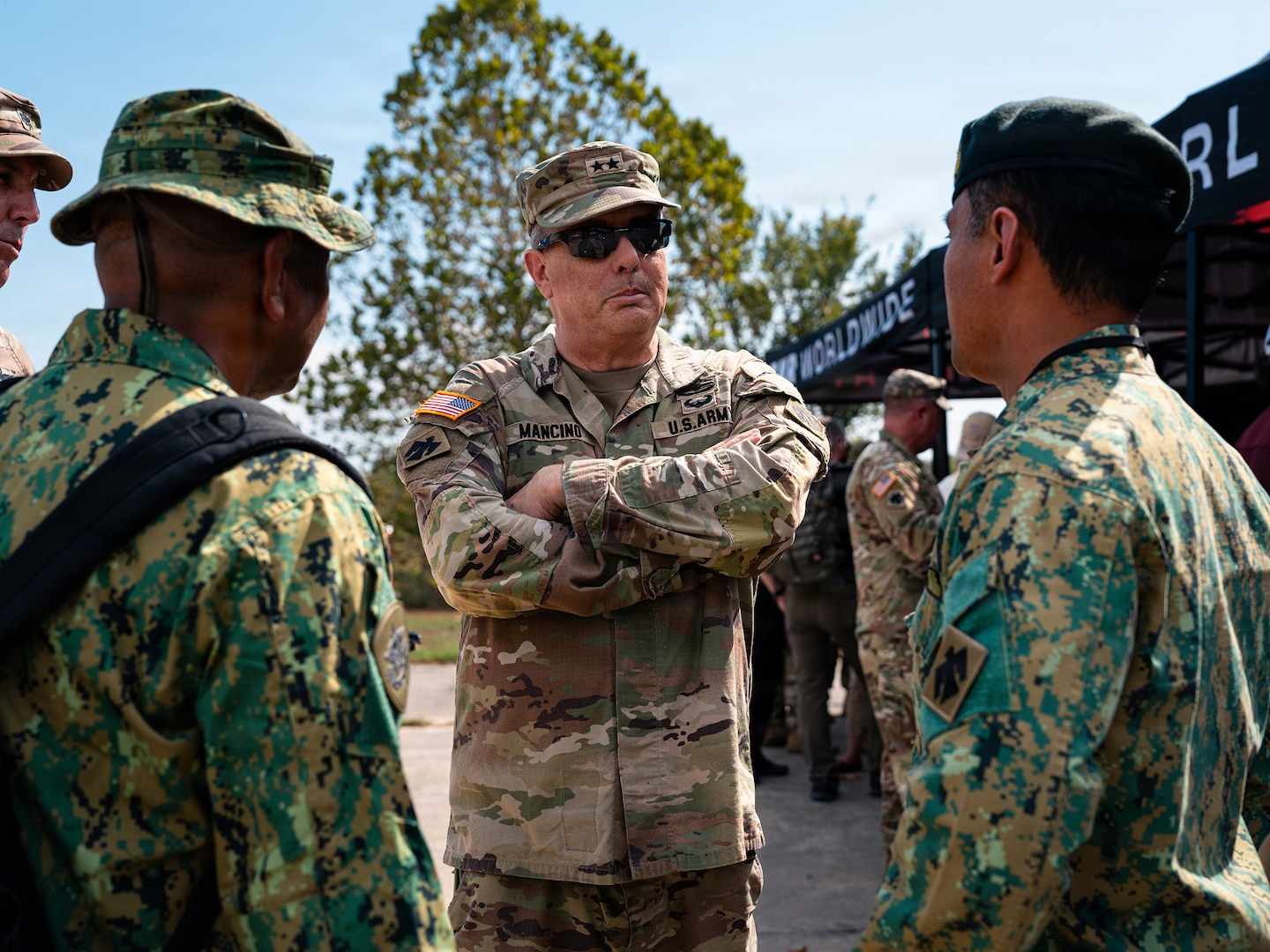 Brig. Gen. Thomas H. Mancino, adjutant general for the Oklahoma National Guard, speaks with members of an international partner delegation during Exercise Thunderstruck 3.0 at Camp Gruber Training Center near Braggs, Oklahoma, Sept. 12, 2026.