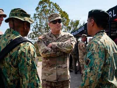 Brig. Gen. Thomas H. Mancino, adjutant general for the Oklahoma National Guard, speaks with members of an international partner delegation during Exercise Thunderstruck 3.0 at Camp Gruber Training Center near Braggs, Oklahoma, Sept. 12, 2026.