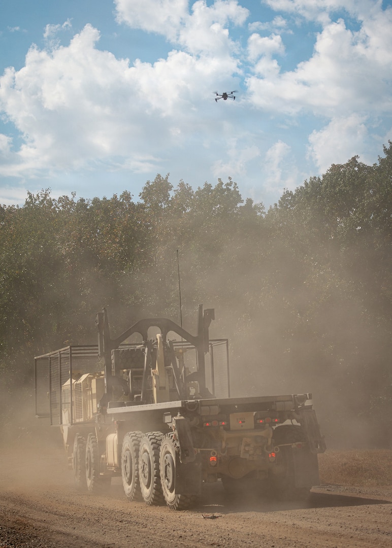 A MAVIC 3E drone hovers over a Palletized Load System during counter-UAS convoy operations training at Exercise Thunderstruck 3.0, at Camp Gruber Training Center near Braggs, Oklahoma, Sept. 12, 2026.