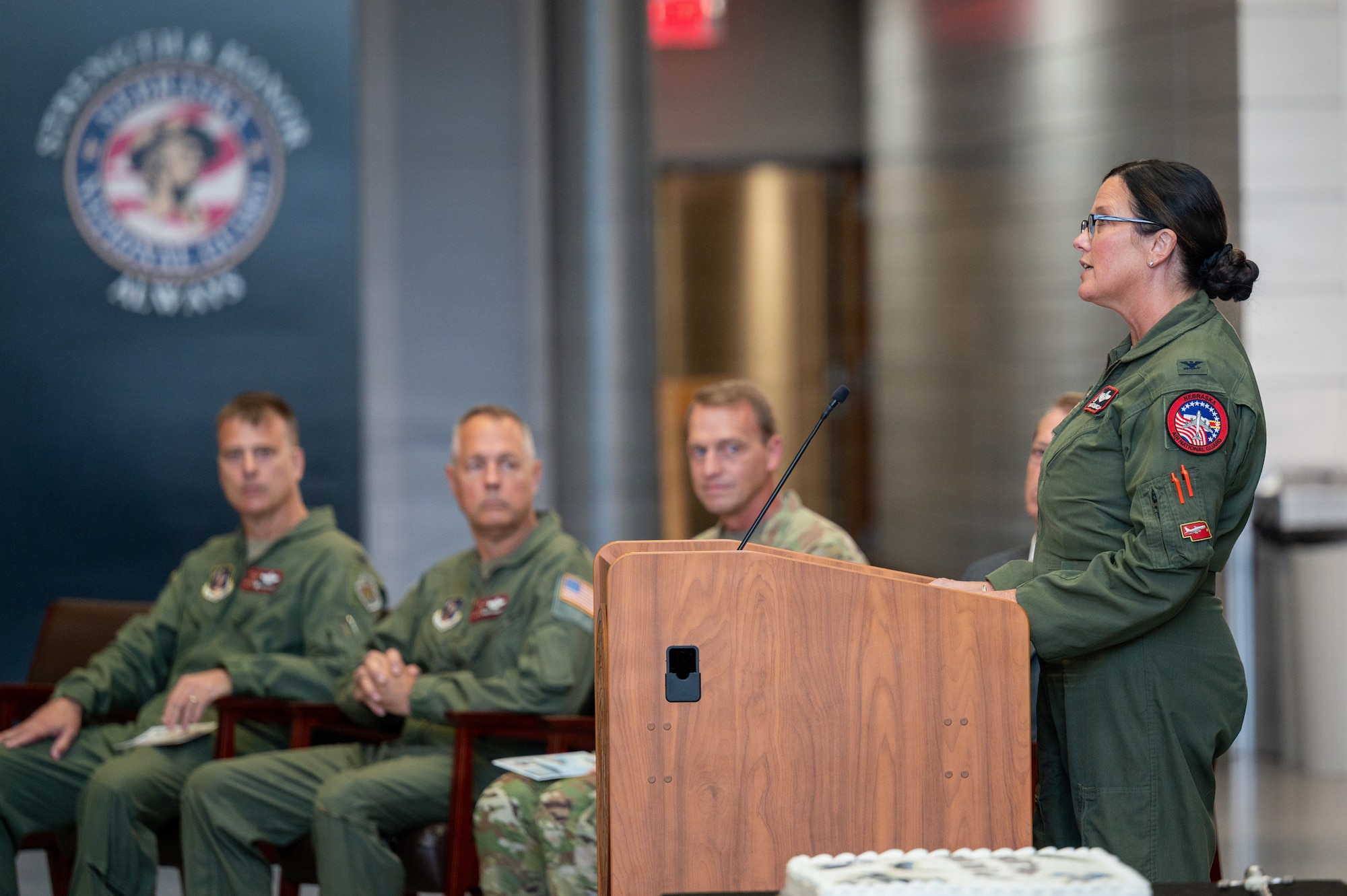 Col. Wendy Squarcia, 170th Group commander, addresses Nebraska National Guard service members, retirees and other guests during a ceremony commemorating the 80th anniversary of the Nebraska Air National Guard at the Joint Force Headquarters building in Lincoln, Nebraska, Sept. 13, 2026. Squarcia reflected on the group’s growth and how the integration of National Guard and active duty forces demonstrates the effectiveness of working together to accomplish a shared mission. (U.S. Air National Guard photo by Senior Airman Jeremiah Johnson)