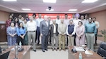 Dr. Tom Lynch of INSS stands next to military strategy and intelligence leaders during a visit to New Delhi, India.