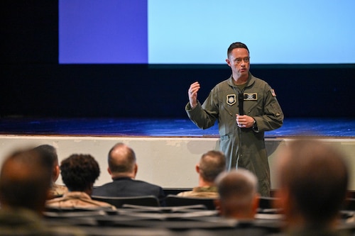 Service member speaks to crowd