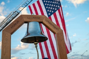 Bell in front of United States flag