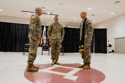 Col. Glenn Finch, outgoing state command chaplain, left; Brig. Gen. Adam Curry, director of the joint staff for the Florida National Guard, center; and Lt. Col. Lance Sellon, incoming state command chaplain, conduct a changing of the stole ceremony at the Robert F. Ensslin Jr. Armory, Florida, Sept. 12, 2026.