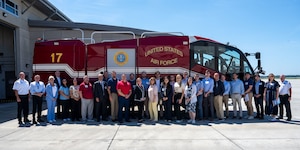 Members of a congressional staff delegation pose for a photo with firefighters at Wright-Patterson Air Force Base Fire Station Aug. 25, 2026. The staff members received an overview of fire department operations and learned about the responsibilities of Wright-Patterson AFB firefighters. (U.S. Air Force photo by Jack Gardner)