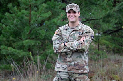 Pvt. Matthew Scaccia, an infantryman with the New Hamphsire National Guard's C Company, 3rd Battalion, 172nd Infantry Regiment (Mountain), poses with his newly earned Airborne wings and Ranger tab Sept. 1 at the state military reservation in Concord.