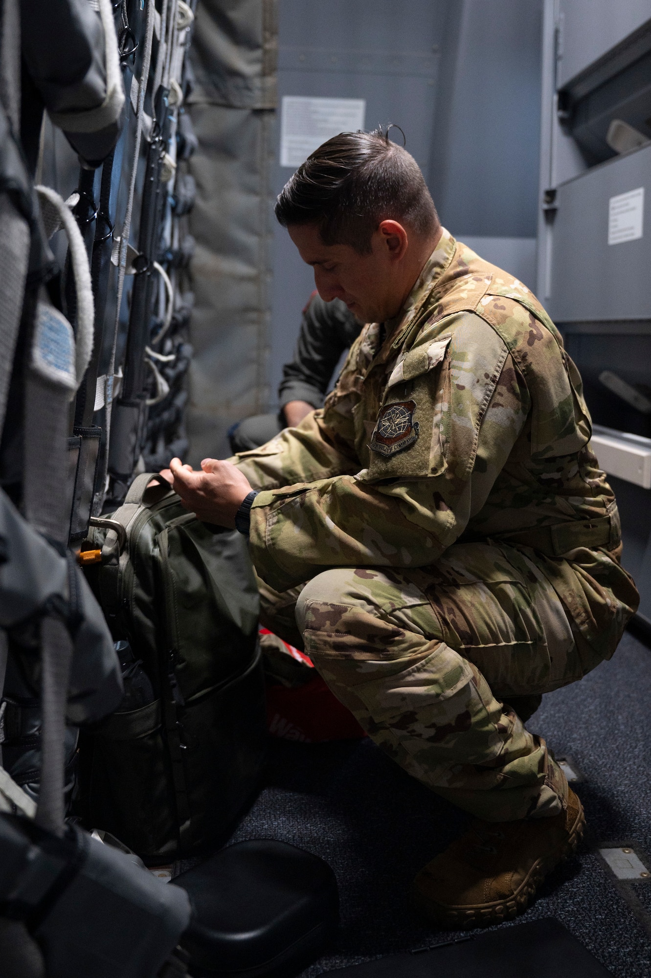 U.S. Air Force Master Sgt. Javier Garcia, 2nd Air Refueling Squadron KC-46A Pegasus aircraft boom operator instructor, secures his personal belongings before a routine training flight at Joint Base McGuire-Dix-Lakehurst, N.J., July 31, 2026.