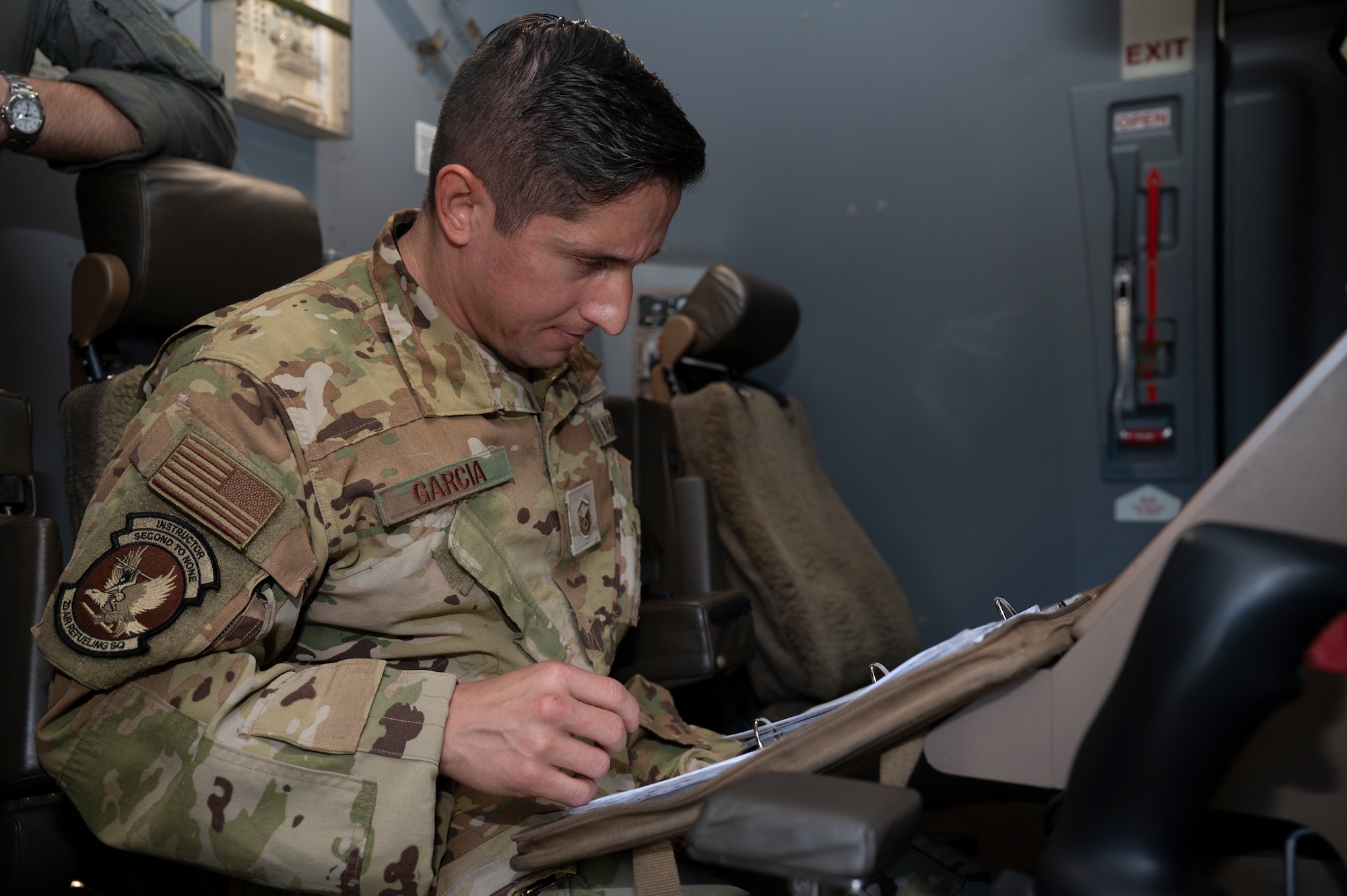 U.S. Air Force Master Sgt. Javier Garcia, 2nd Air Refueling Squadron KC-46A Pegasus aircraft boom operator instructor, reviews a preflight checklist before a routine training flight at Joint Base McGuire-Dix-Lakehurst, N.J., July 31, 2026.