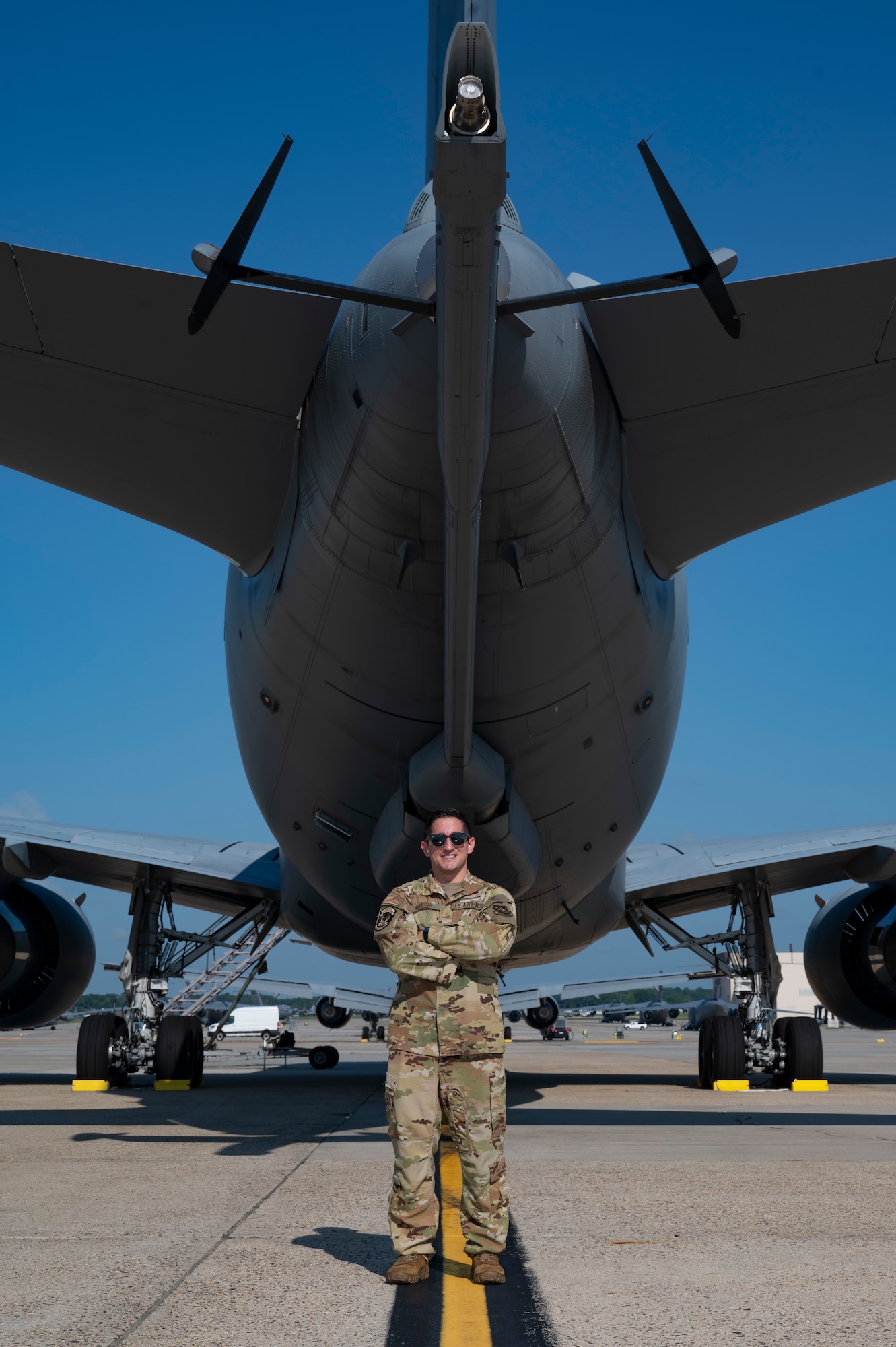 U.S. Air Force Master Sgt. Javier Garcia, 2nd Air Refueling Squadron KC-46A Pegasus aircraft boom operator instructor, poses beneath the boom of a KC-46A before a routine training flight at Joint Base McGuire-Dix-Lakehurst, N.J., July 31, 2026.