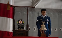 An Airman rings the ceremonial bell.