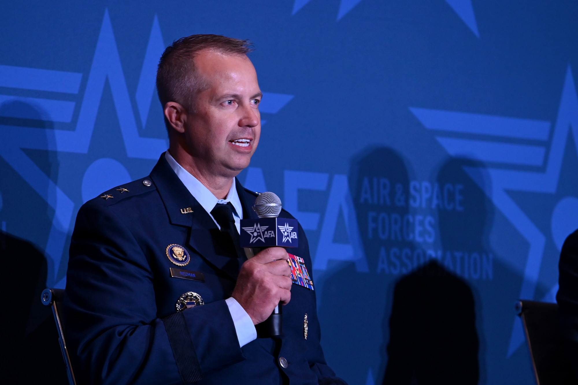 Maj. Gen. Ty Neuman (center), Eighth Air Force and Joint-Global Operations Center commander, speaks at the Long-Range Airpower: Lessons From Midnight Hammer and Epic Fury panel