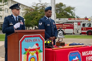 U.S. Air Force Col. Oliver Lause, 35th Fighter Wing commander, delivers remarks during a Patriot Day remembrance ceremony at Misawa Air Base, Japan, Sept. 11, 2026. Lause reflected on the significance of Sept. 11 and the enduring commitment to honor those who lost their lives and those who answered the call to serve. (U.S. Air Force photo by Airman 1st Class Angelica Winther)