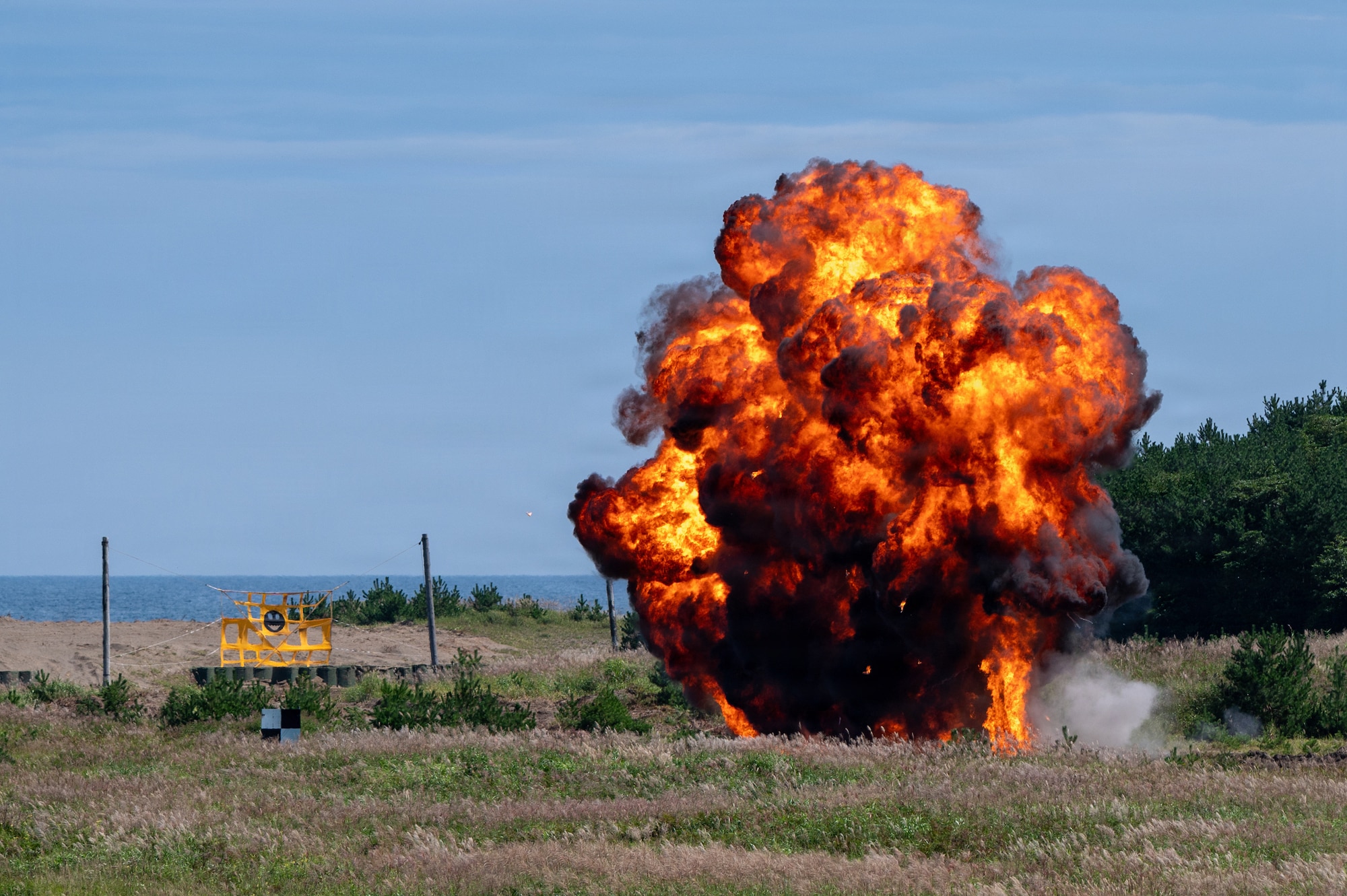 Ordnance detonates after being deployed by a U.S. Air Force F-16 Fighting Falcon during Misawa Range Day at Draughon Range near Misawa Air Base, Japan, Sept. 11, 2026. Live munitions training showcased the precision combat capabilities 35th Fighter Wing Airmen maintain to generate credible airpower, deter aggression and remain ready to respond to operational demands across the Pacific. (U.S. Air Force photo by Airman 1st Class Angelica Winther)