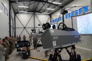 U.S. and NATO allied military leaders receive a demonstration of a flight simulator during a tour of the Henri Coandă Air Force Academy in Brașov, Romania, during the inaugural multinational First Sergeant Symposium