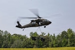 U.S. Soldiers with the 369th Division Sustainment Brigade, New York Army National Guard, conduct sling load operations in cooperation with B Company, 3rd Assault Helicopter Battalion, 142nd Aviation Regiment, during annual training at Fort A.P. Hill, Virginia, in August, 2026. Photo by Spc. Francisco J. Leon.